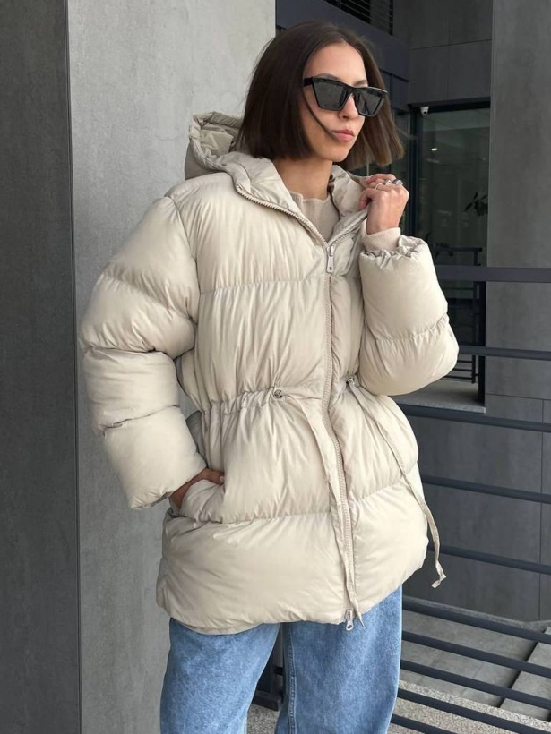 Beige winter down jacket with a drawstring at the waist