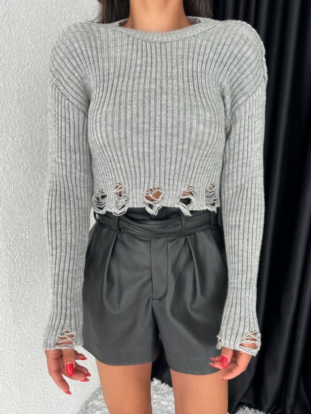 Cropped sweater with a torn bottom