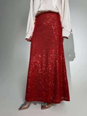 Довга блискуча спідниця в пайетках