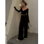 Чорний віскозний костюм з топом та широкими штанами