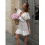 Біла віскозна міні сукня з рюшами з софту Біла віскозна міні сукня з рюшами з софту