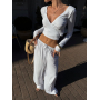 Білий віскозний костюм з топом та широкими штанами 