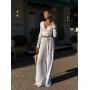 Білий віскозний костюм з топом та широкими штанами 